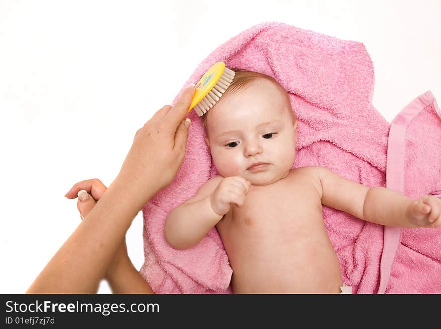 Little baby after bath on white