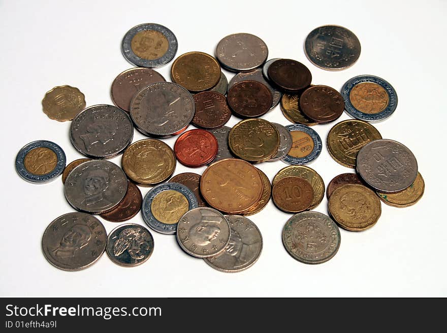 Hong Kong coins in a small pile on a white background. Hong Kong coins in a small pile on a white background