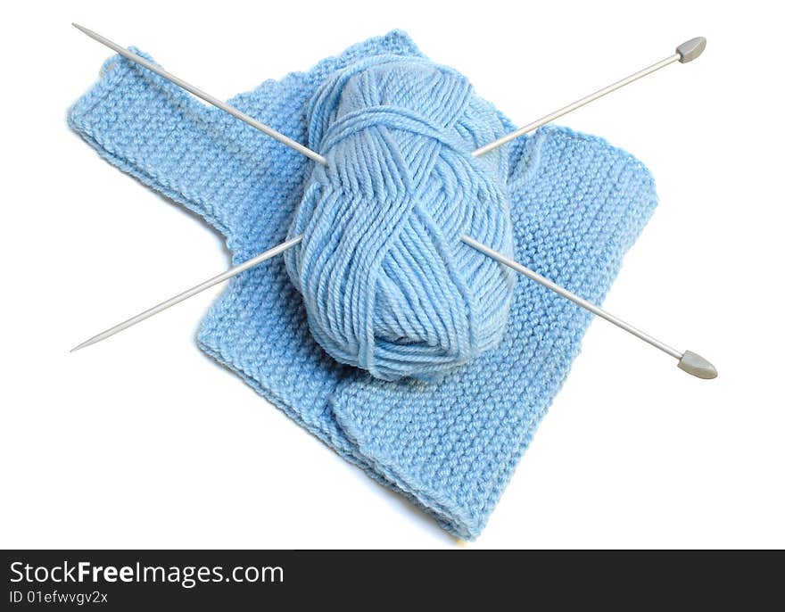 Knitting needles, yarn  and knitting cloth.