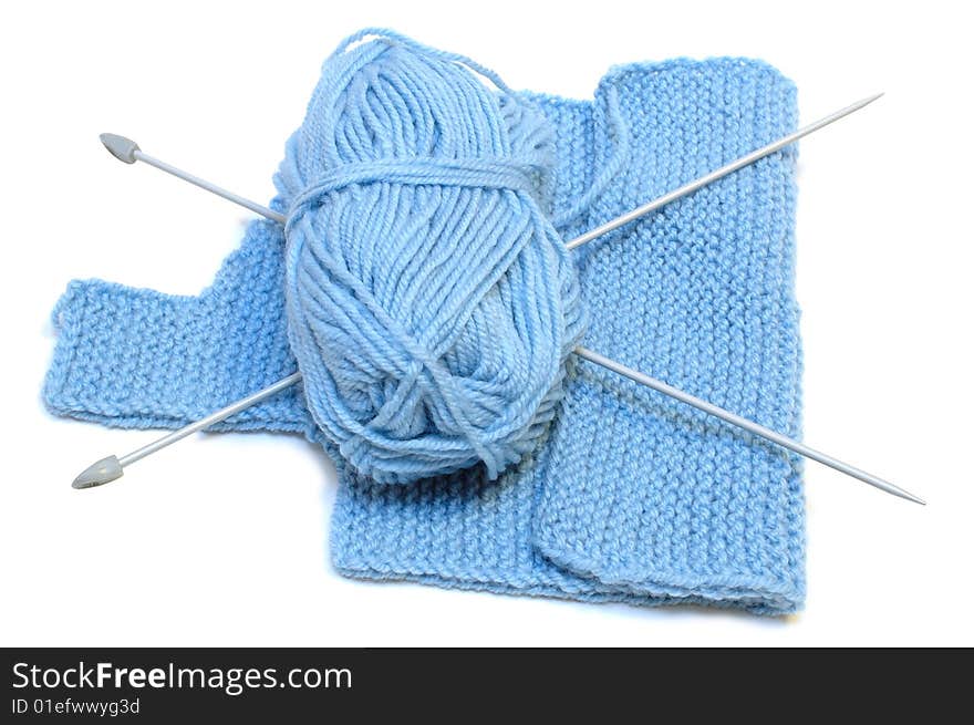 Knitting needles, yarn  and knitting cloth.