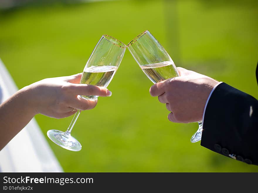 Champagne in hands of lovers. Champagne in hands of lovers