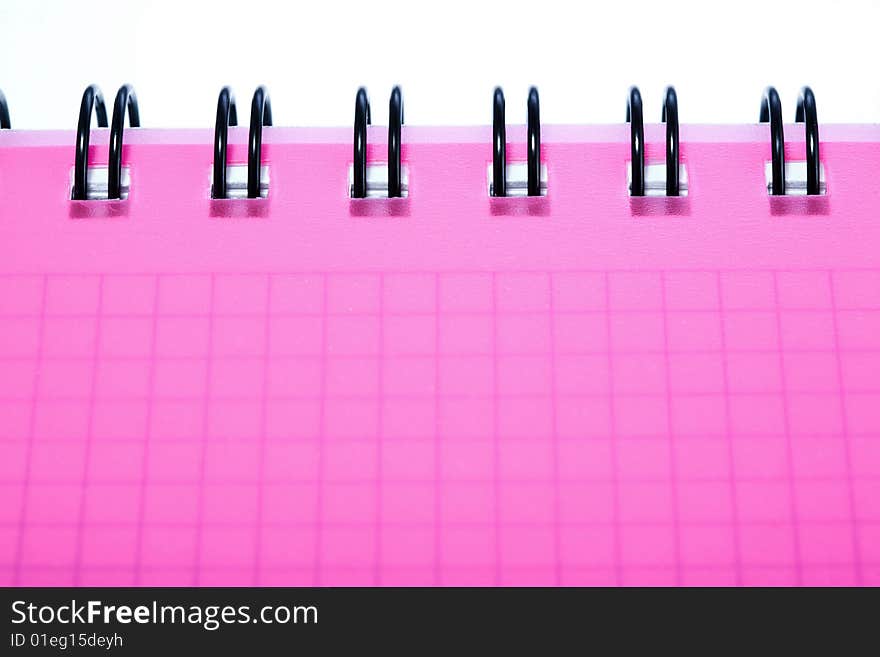 Stock photo: office theme: an image of a part of a pink notebook