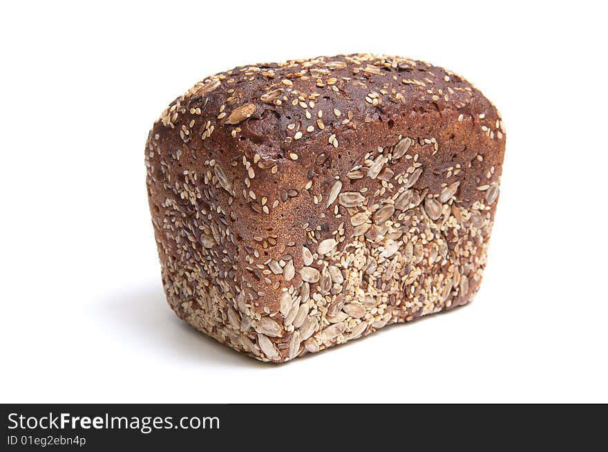 Loaf of bread full of seeds isolated on a white background. Loaf of bread full of seeds isolated on a white background.