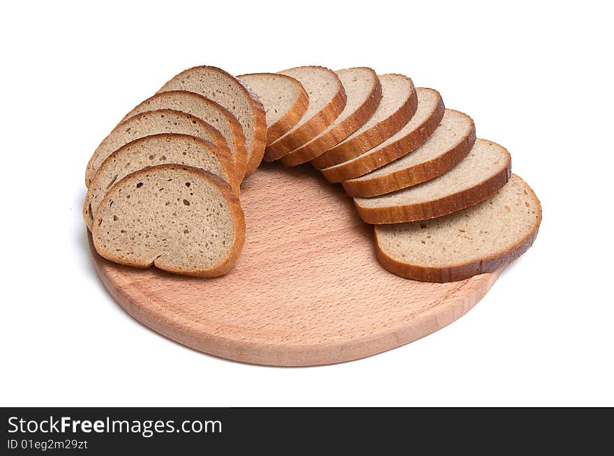 Pieces of long loaf and round board isolated on a white background. Pieces of long loaf and round board isolated on a white background.