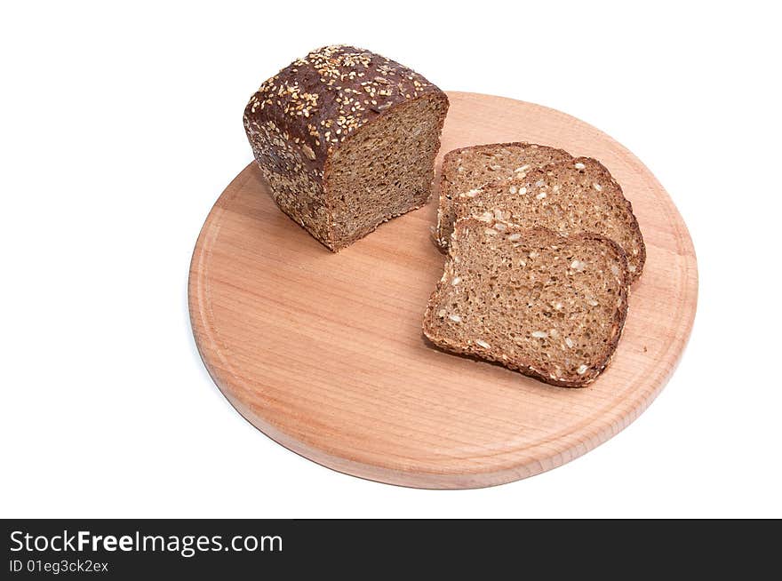 Pieces of bread and round board isolated on a white background. Pieces of bread and round board isolated on a white background.