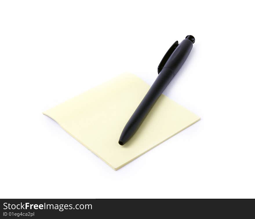 Note with pen on a white background