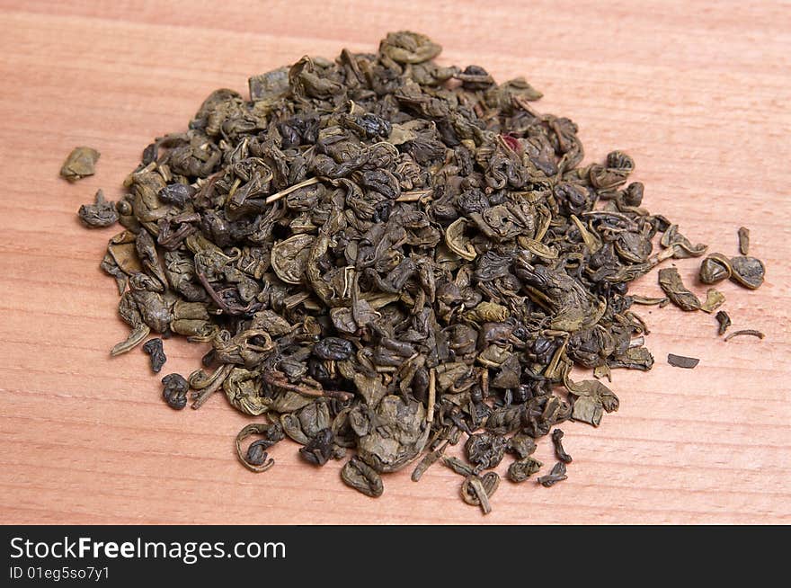 Aromatic green tea leaves .