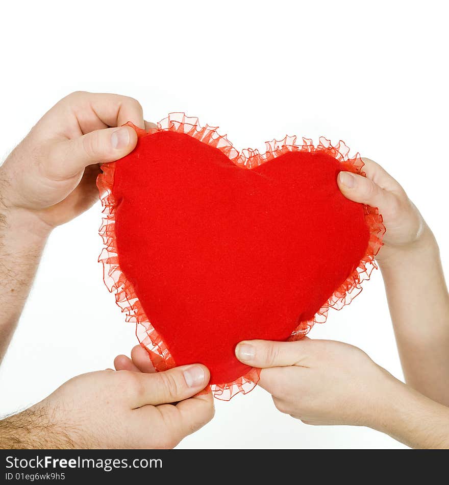 Stock photo: an image of a big red heart in the hands of a woman and a man