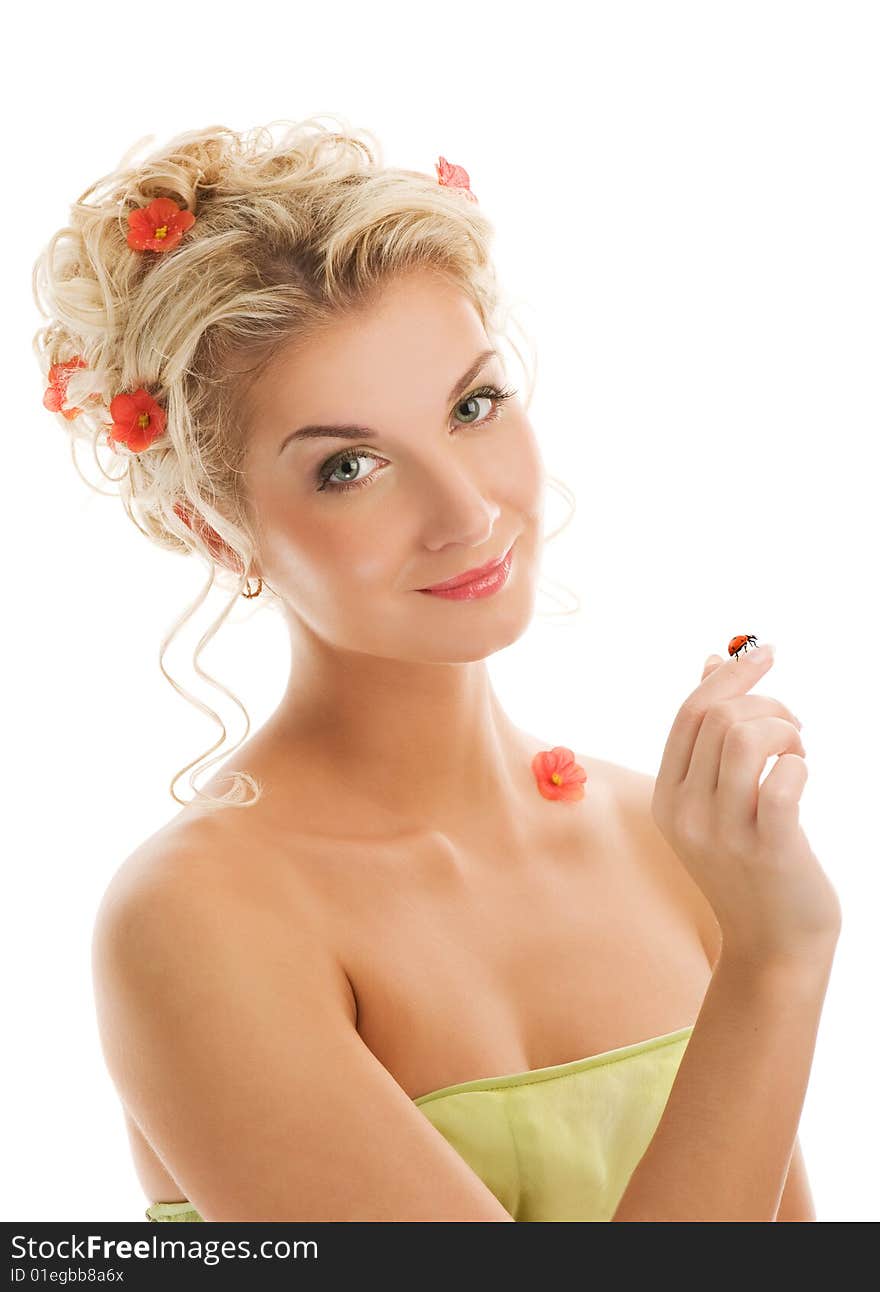 Beautiful young woman with ladybug on her hand. Spring concept