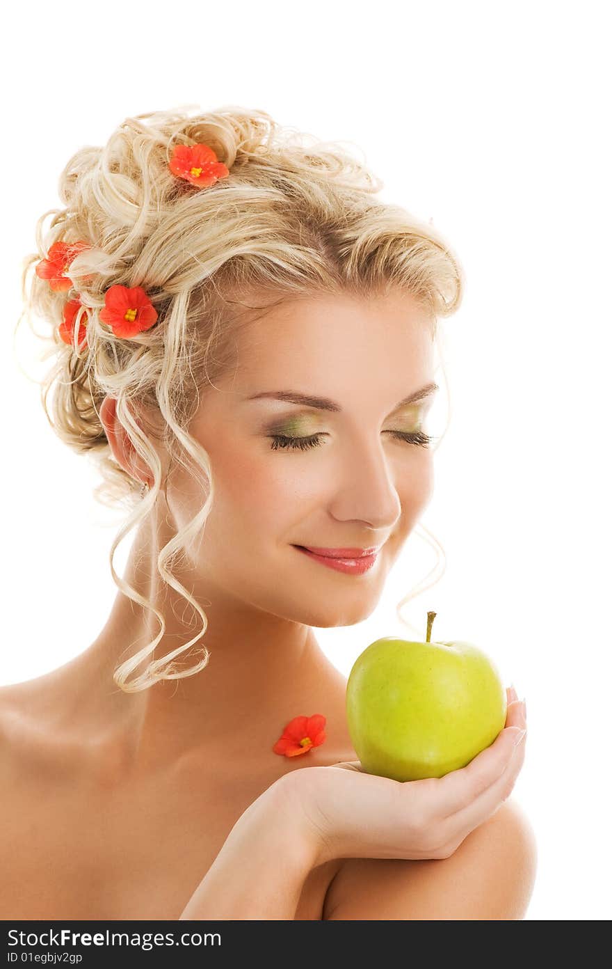 Beautiful young woman with ripe green apple. Spring concept