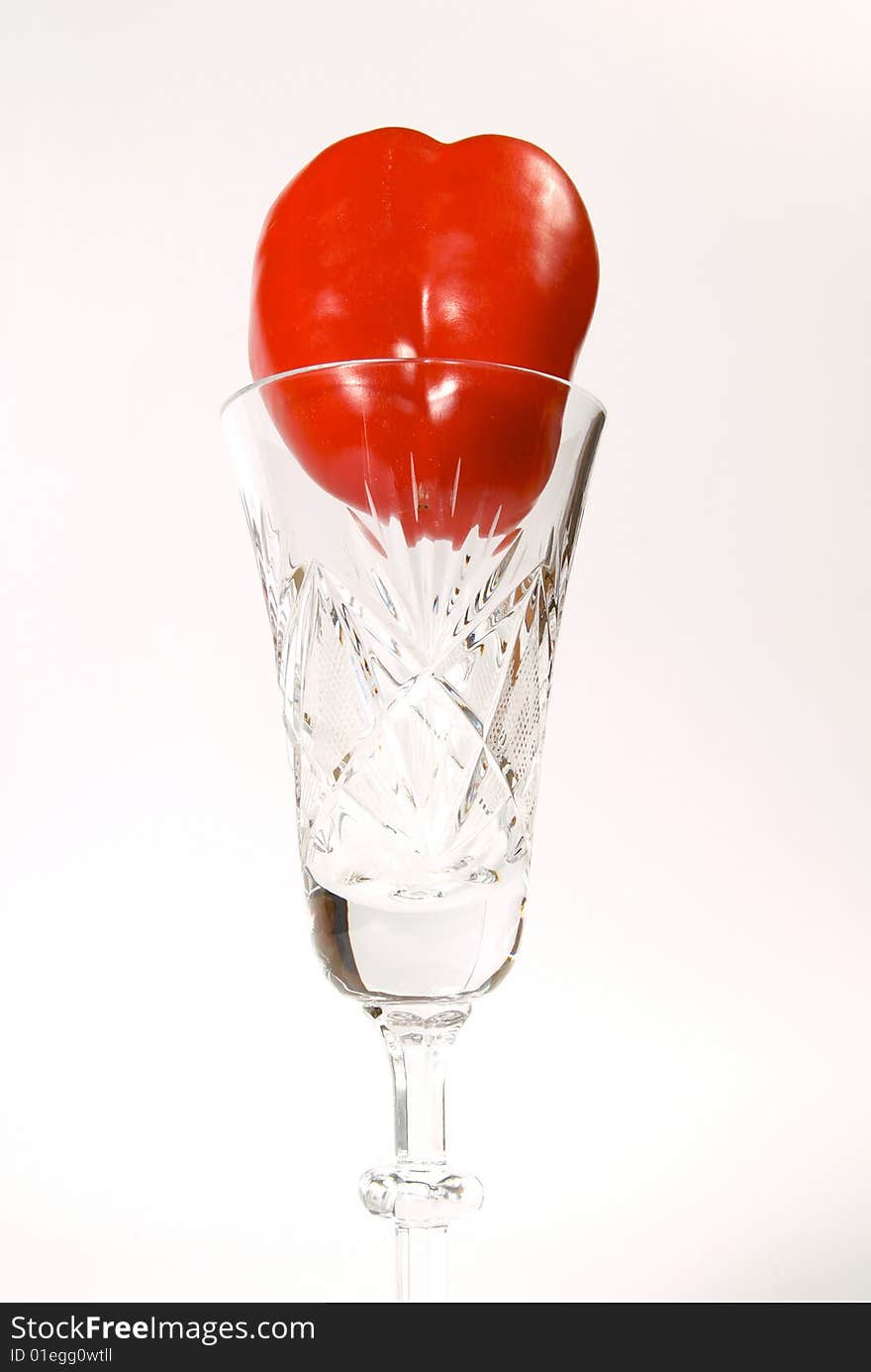 Red pepper in crystal goblet on white background. Red pepper in crystal goblet on white background