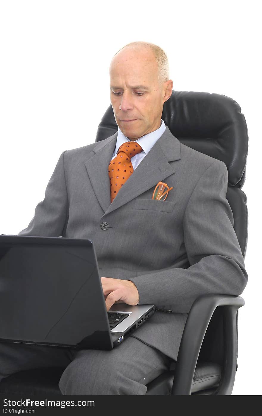 Mature man with laptop isolated in white. Mature man with laptop isolated in white