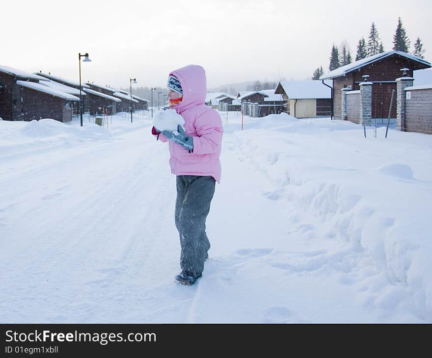 Girl playing with snow