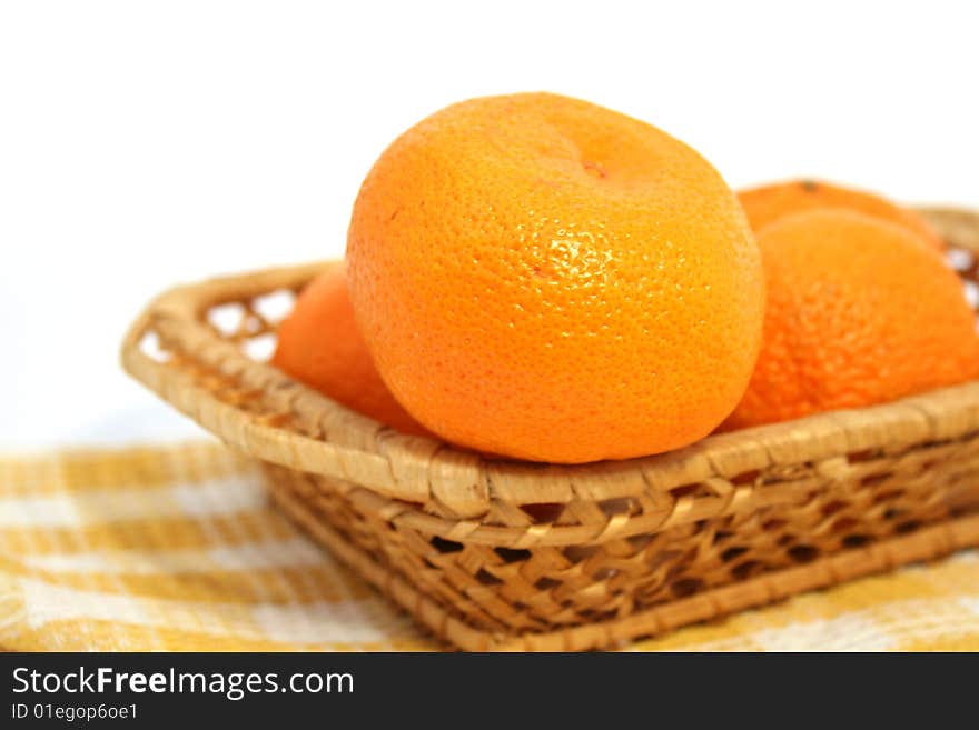 Mandarins in a basket  isolated on a white background