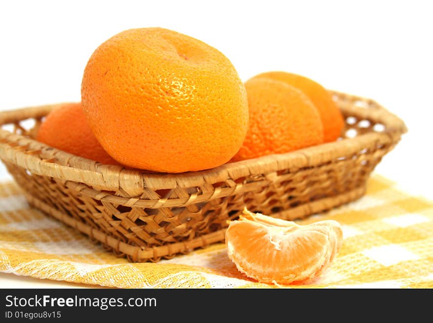 Mandarins in a basket  isolated on a white background