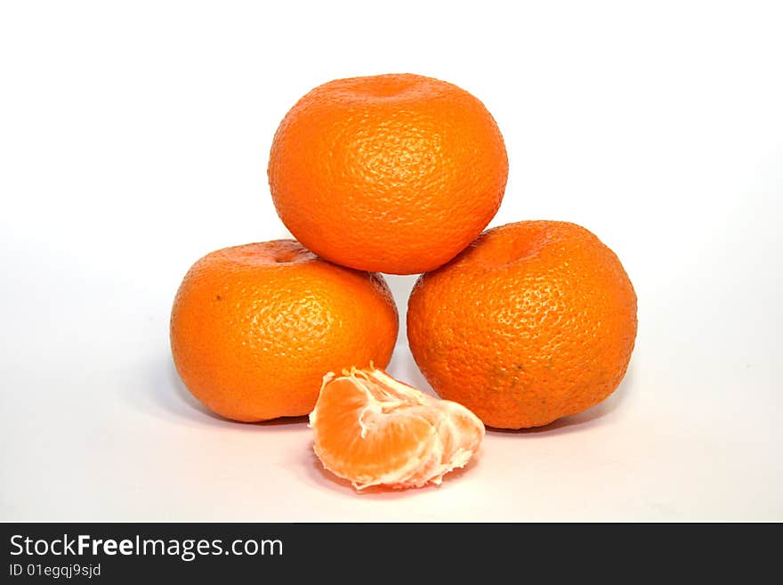 Bright and tasty orange tangerines pyramid isolated on white. Bright and tasty orange tangerines pyramid isolated on white