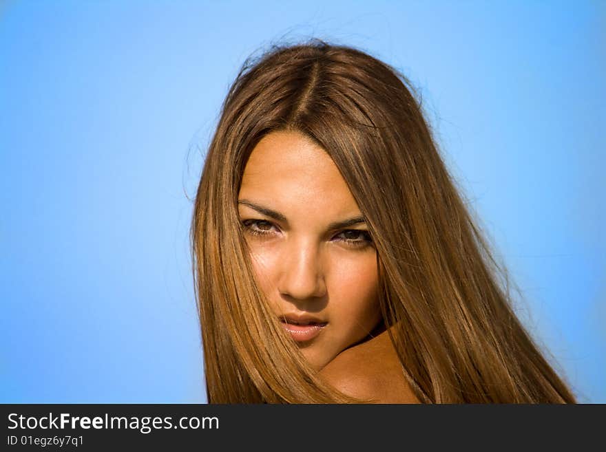 Swarthy young girl poses on the beach. Swarthy young girl poses on the beach