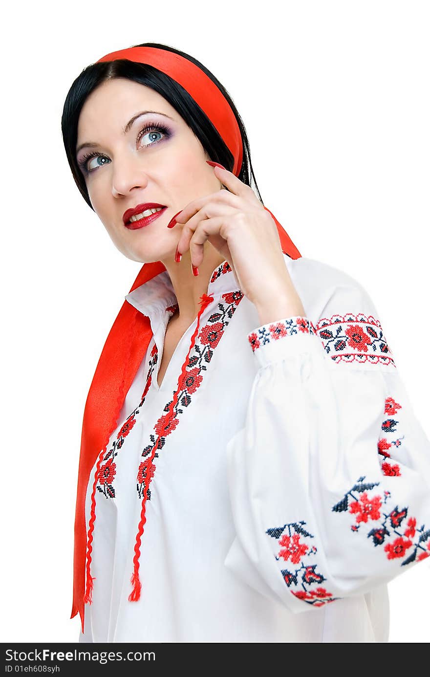 Beauty woman looks darkly, she is in traditional ukrainian clothes. Beauty woman looks darkly, she is in traditional ukrainian clothes