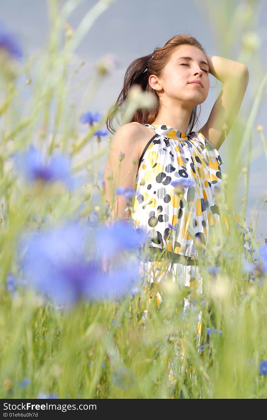 Girl posing in field of flowers