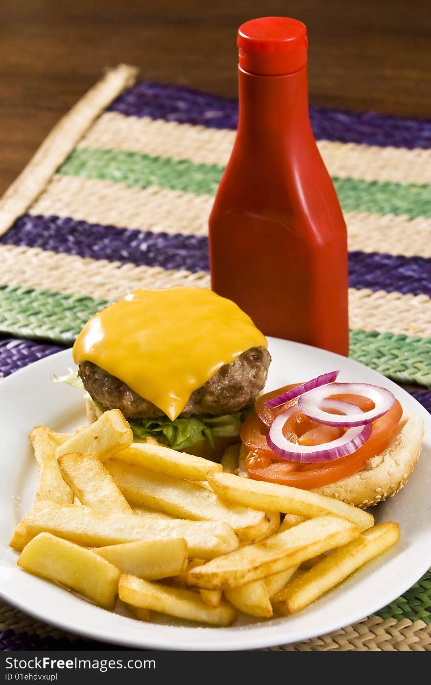 Cheeseburger with ketchup and french fries. Cheeseburger with ketchup and french fries