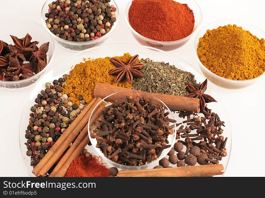 Spices in small glass bowl and plates