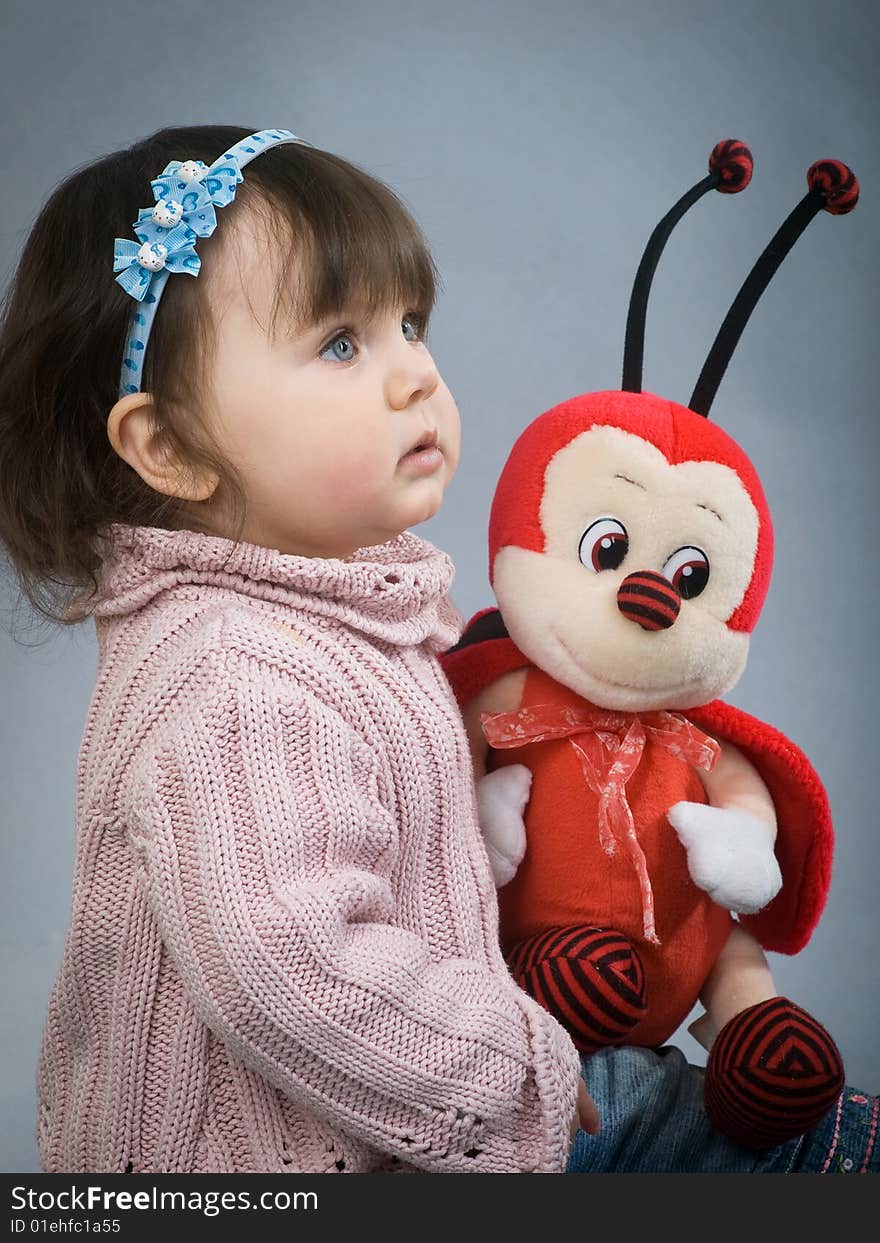 Cute baby with blue eyes on grey background. Cute baby with blue eyes on grey background