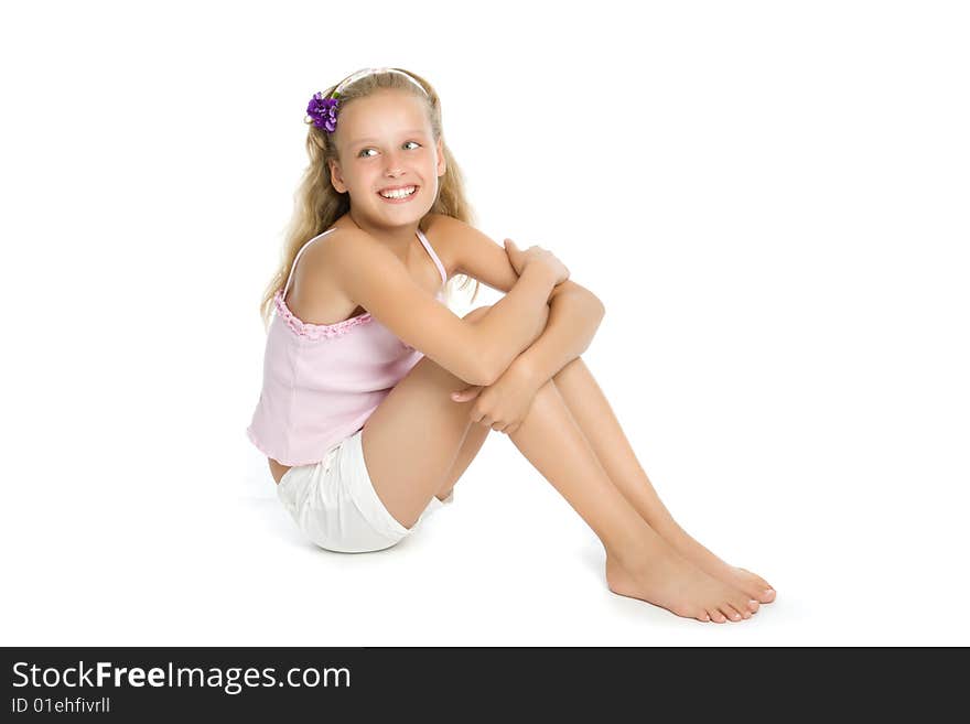 Pretty teenage girl sit on floor isolated on white