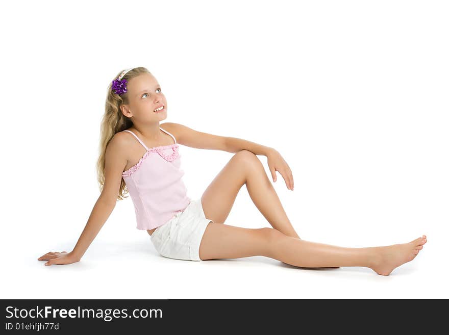 Pretty teenage girl sit on floor isolated on white