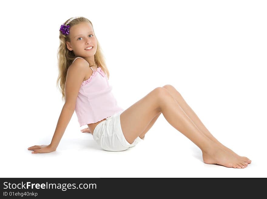 Pretty teenage girl sit on floor isolated on white