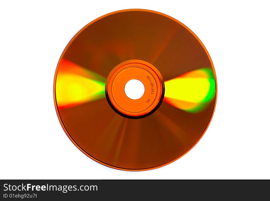 Shiny colored glares on yellow CD/DVD isolated on white