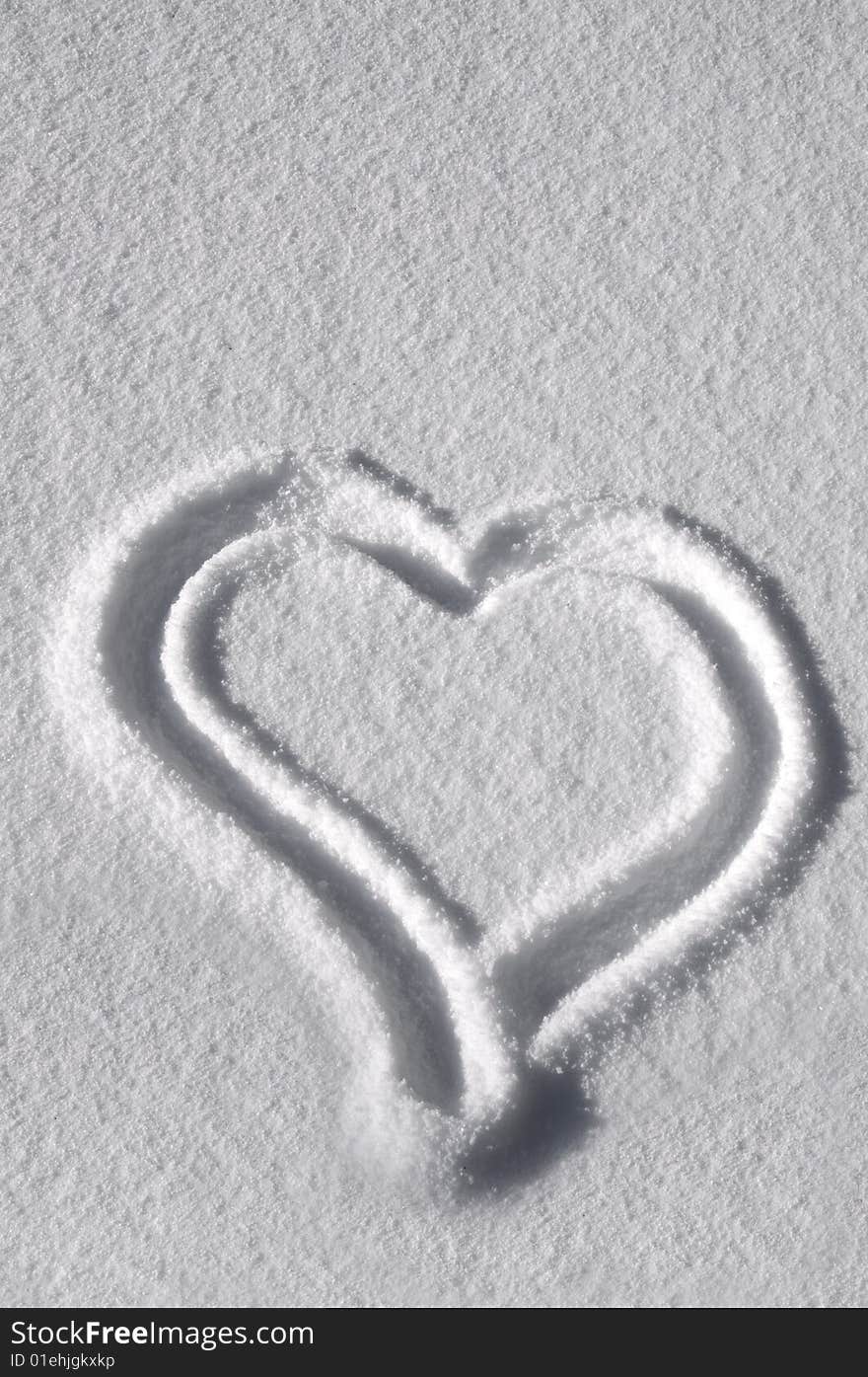 Heart drawn in the snow. Heart drawn in the snow