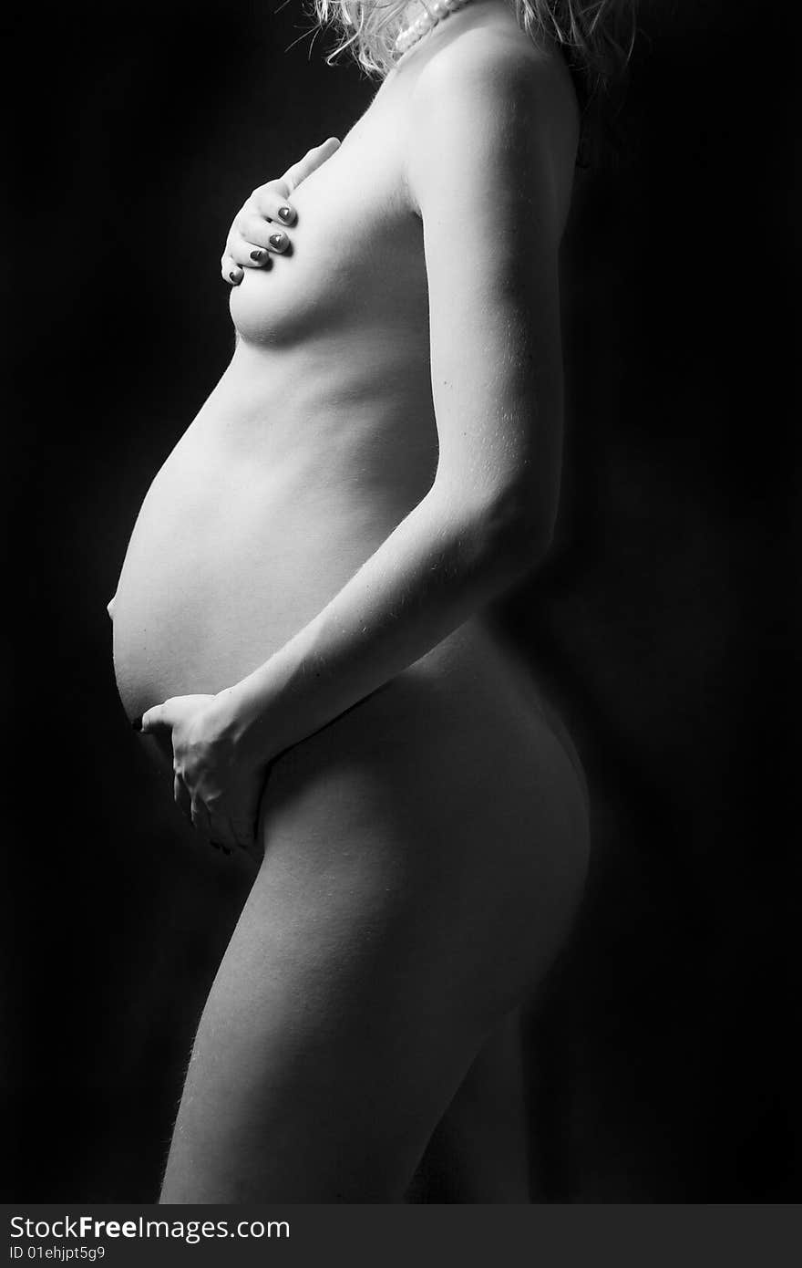 Pregnant Woman Holding Her Belly.