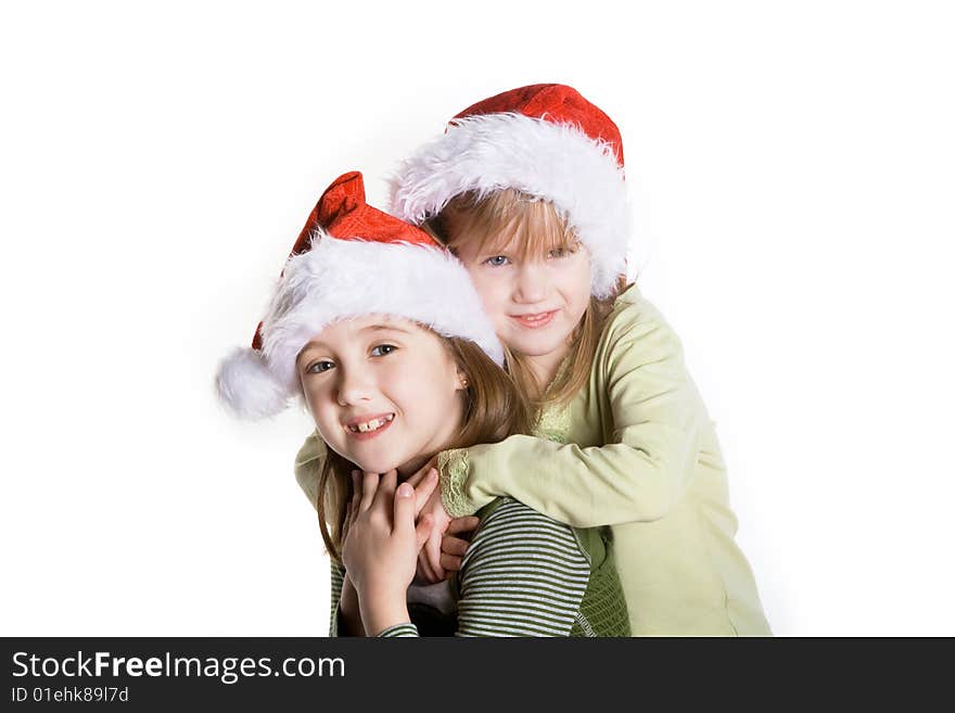 2 sisters wearing santa hats. 2 sisters wearing santa hats