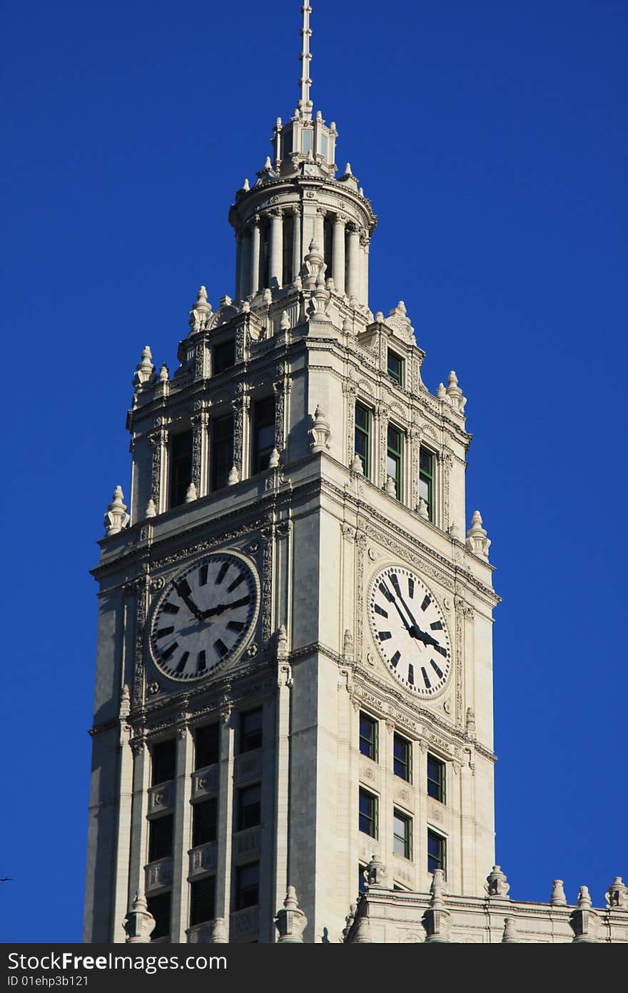 Two clocks are on the beautiful Wrigley building in downtown Chicago. Two clocks are on the beautiful Wrigley building in downtown Chicago.