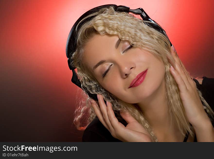 Blond woman listening to the music