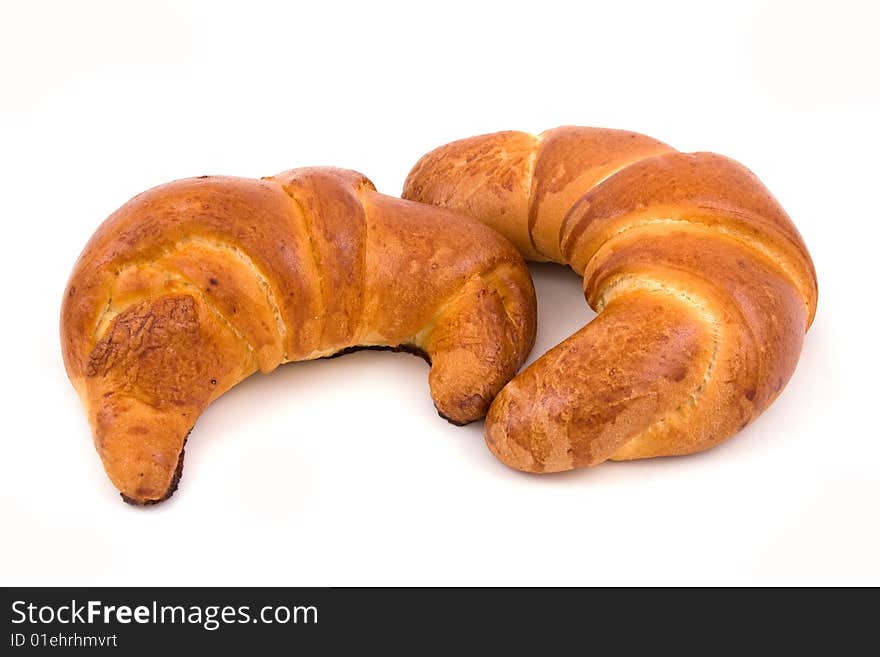 Two croissant isolated on a white. Two croissant isolated on a white