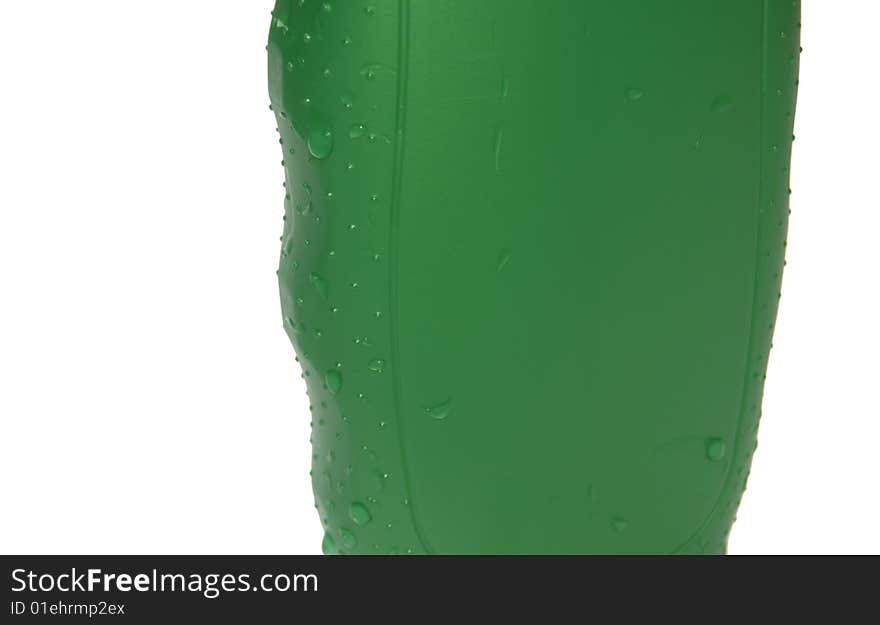 Photo, the front view of a bottle of a shower gel with drops of water.