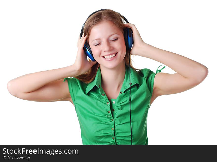 Young beautiful woman listening music with headpfones. Young beautiful woman listening music with headpfones