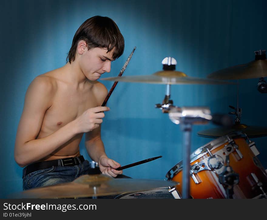 A young male drummer in action