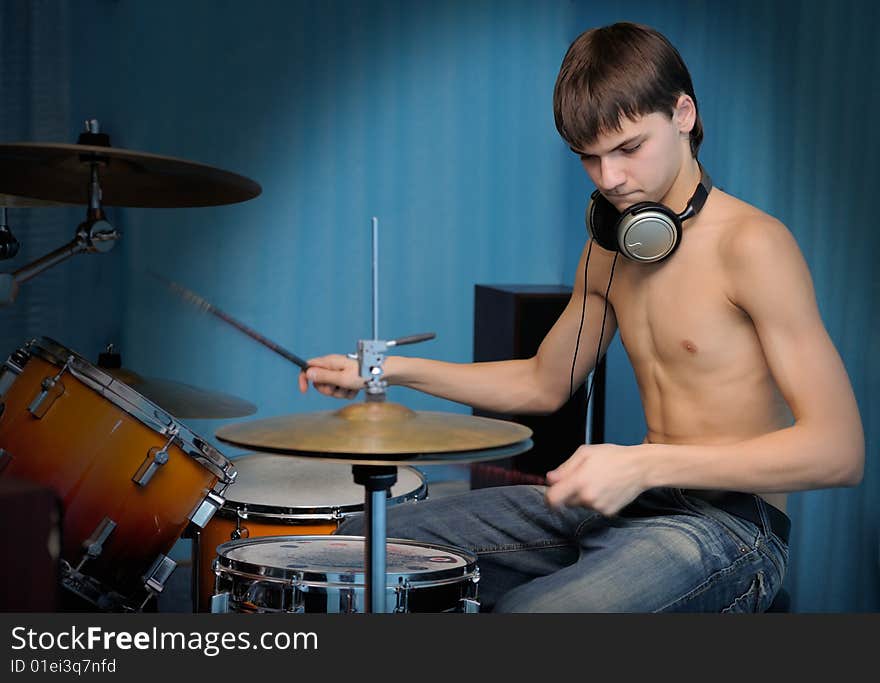 A young male drummer in action