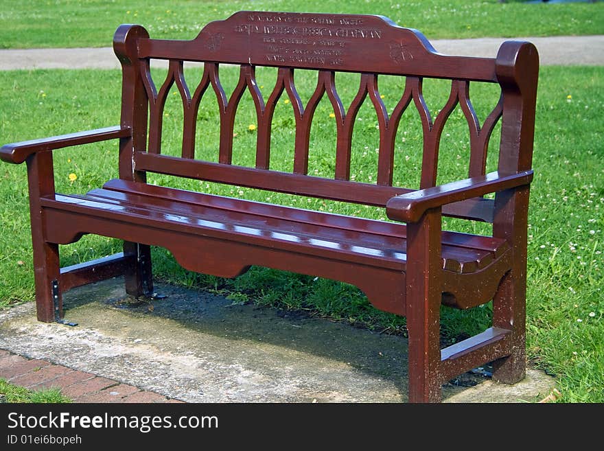 Empty bench in a public park during summer