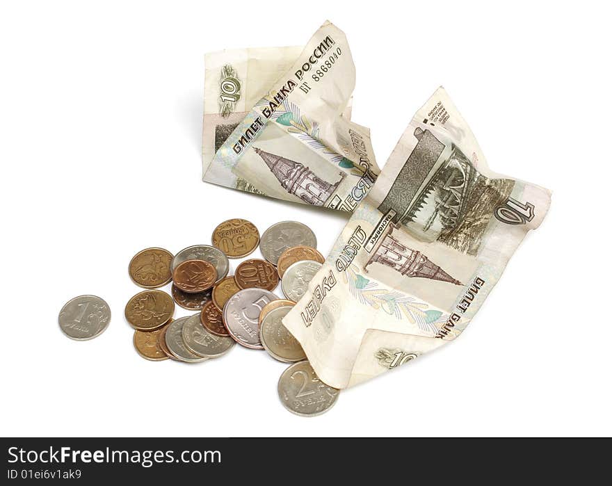 Paper money and coins are isolated on a white background