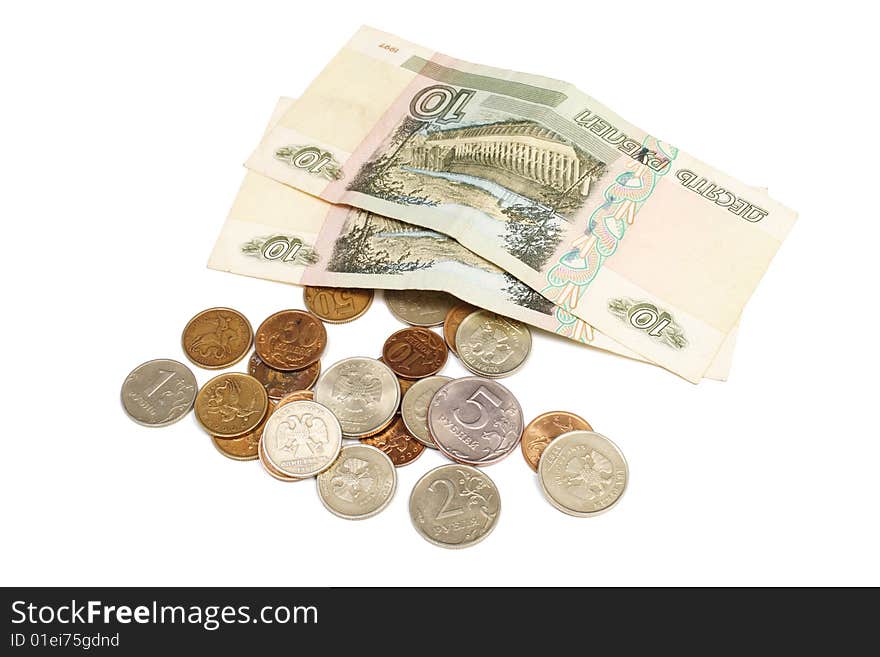 Paper money and coins are isolated on a white background