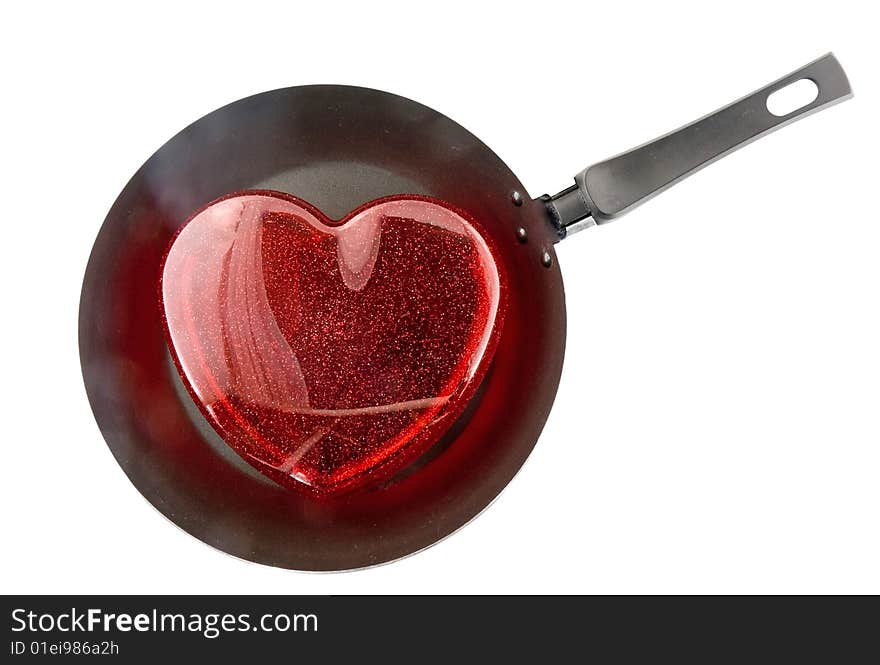 Frying pan with the big red heart. Fried heart