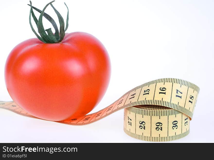 Fresh Tomato with measuring tape on white background