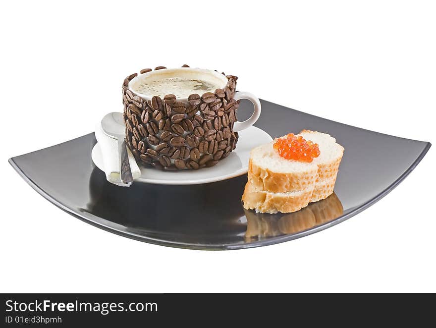 The coffee cup , original decorated by coffee grains(beans) with bread, red caviar. Isolated on white. The coffee cup , original decorated by coffee grains(beans) with bread, red caviar. Isolated on white.