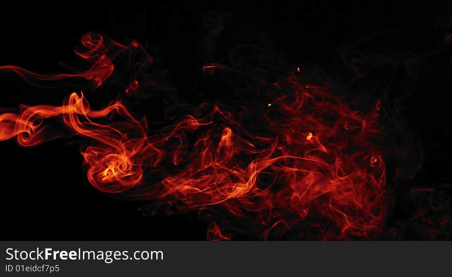 Red smoke isolated on black background