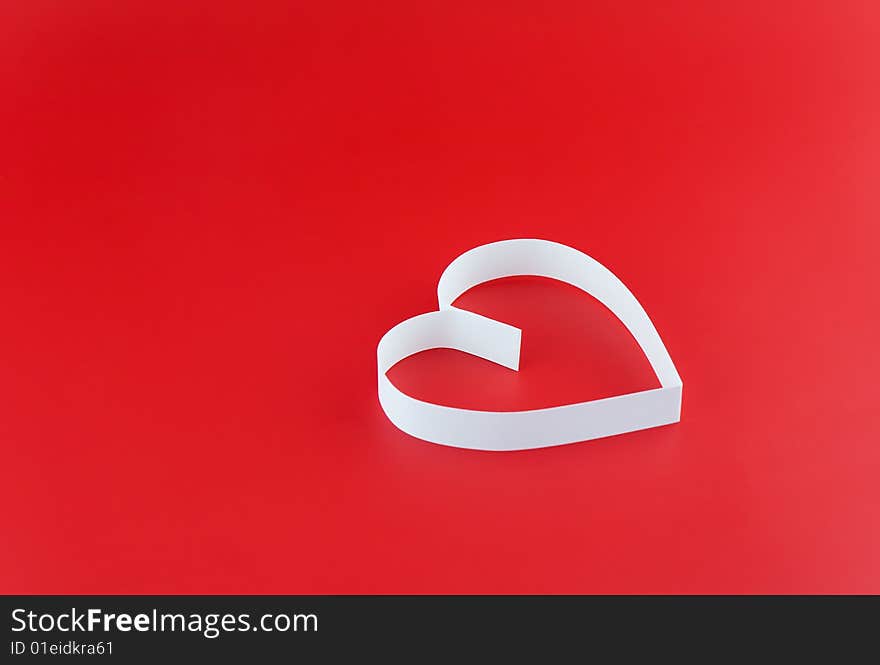 Single white hearts,on red background.