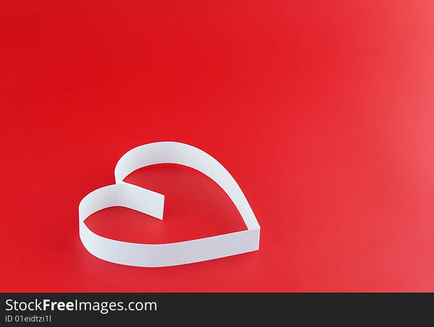 Single white hearts,on red background.