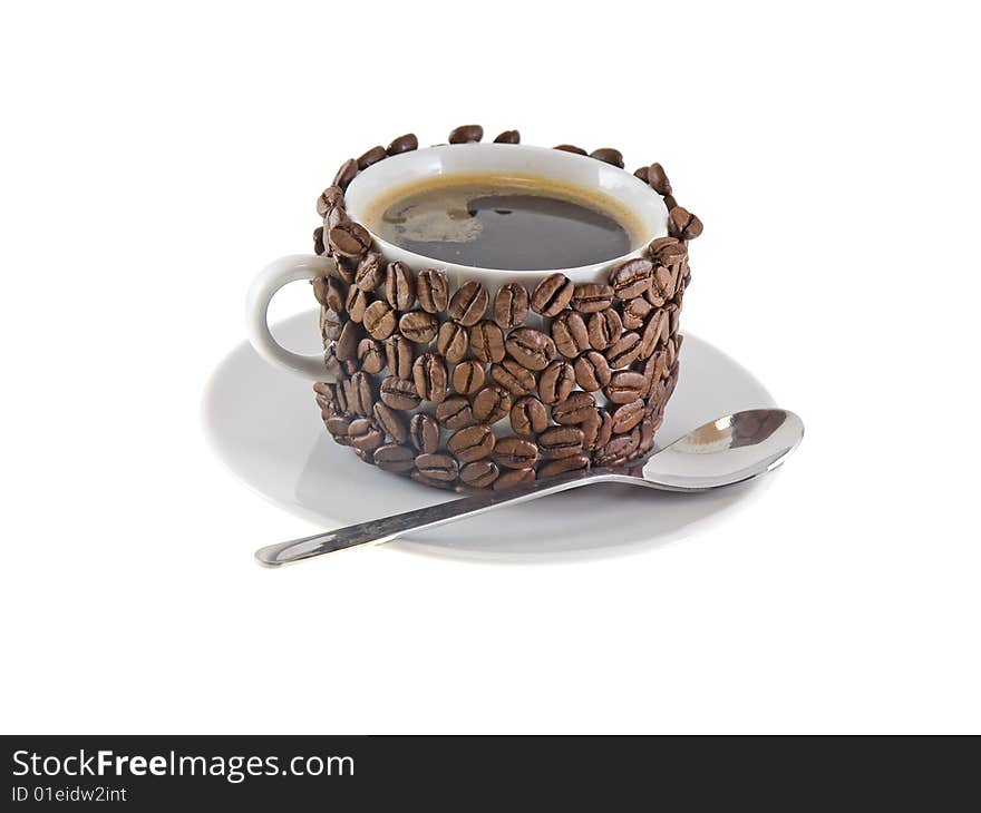 The cup of coffee  and  spoon, original decorated by  coffee beans. Isolated on white. The cup of coffee  and  spoon, original decorated by  coffee beans. Isolated on white.